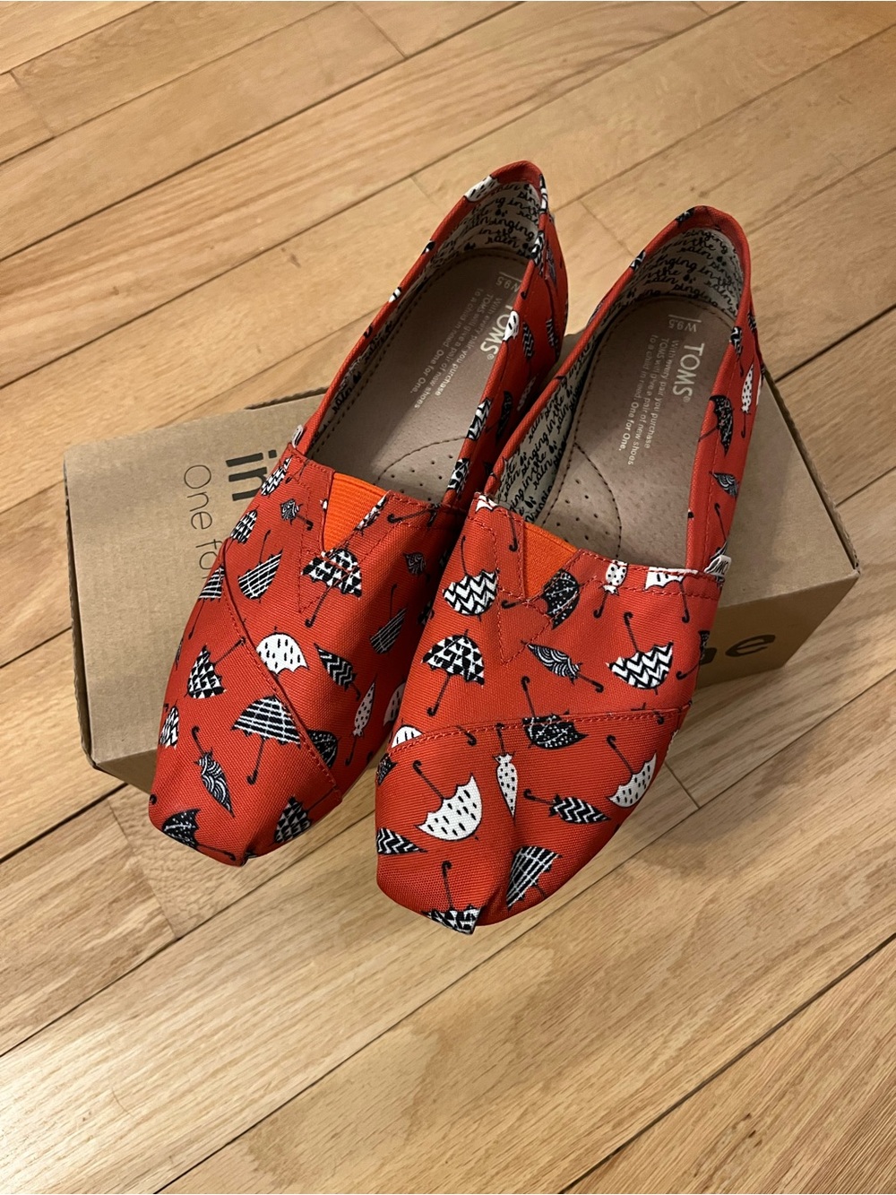 TOMS Red Singing in the Rain Canvas Slip-Ons with Black & White Umbrella Print